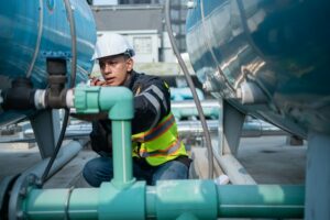 Industrial Engineer Checking Equipment with Tool