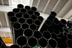 steel metal pipe stack inside factory